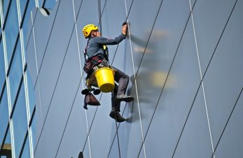 man cleaning building - ERP Solution to business management