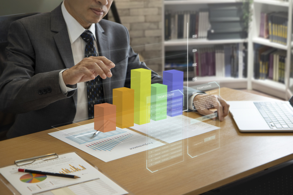 asian businessman interacting with augmented reality threedimensional graph analyzing business info 1024x683 - Learn How To Set A Budget For ERP Software Purchase
