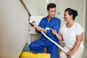 handyman helping senior woman kitchen 300x200 - How to Manage Customer Relationship in Field Service Industry